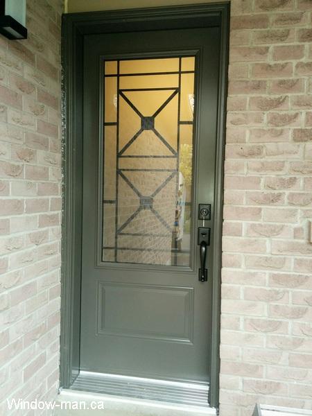 Single insulated steel front entry door. Three quarters glass. Century wrought iron glass inserts